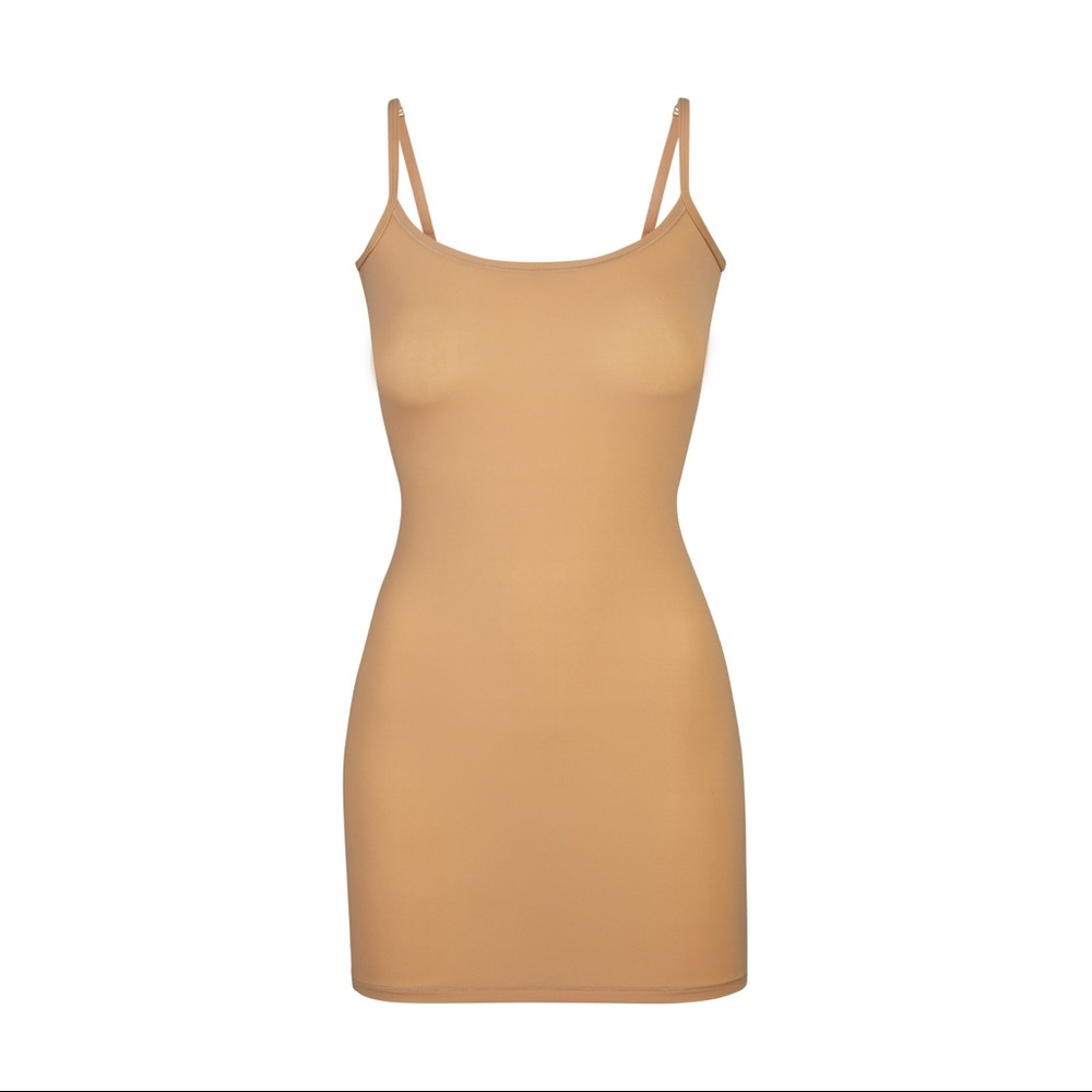This basic slip dress can styled alone as a layering slip dress or accessorized